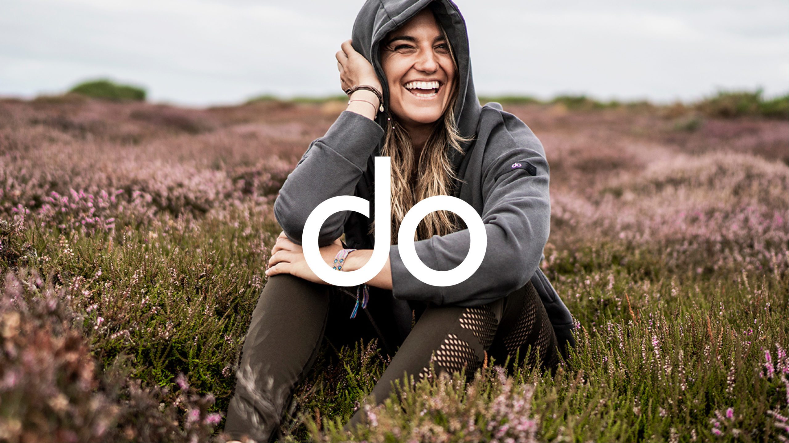 female model in suit sitting